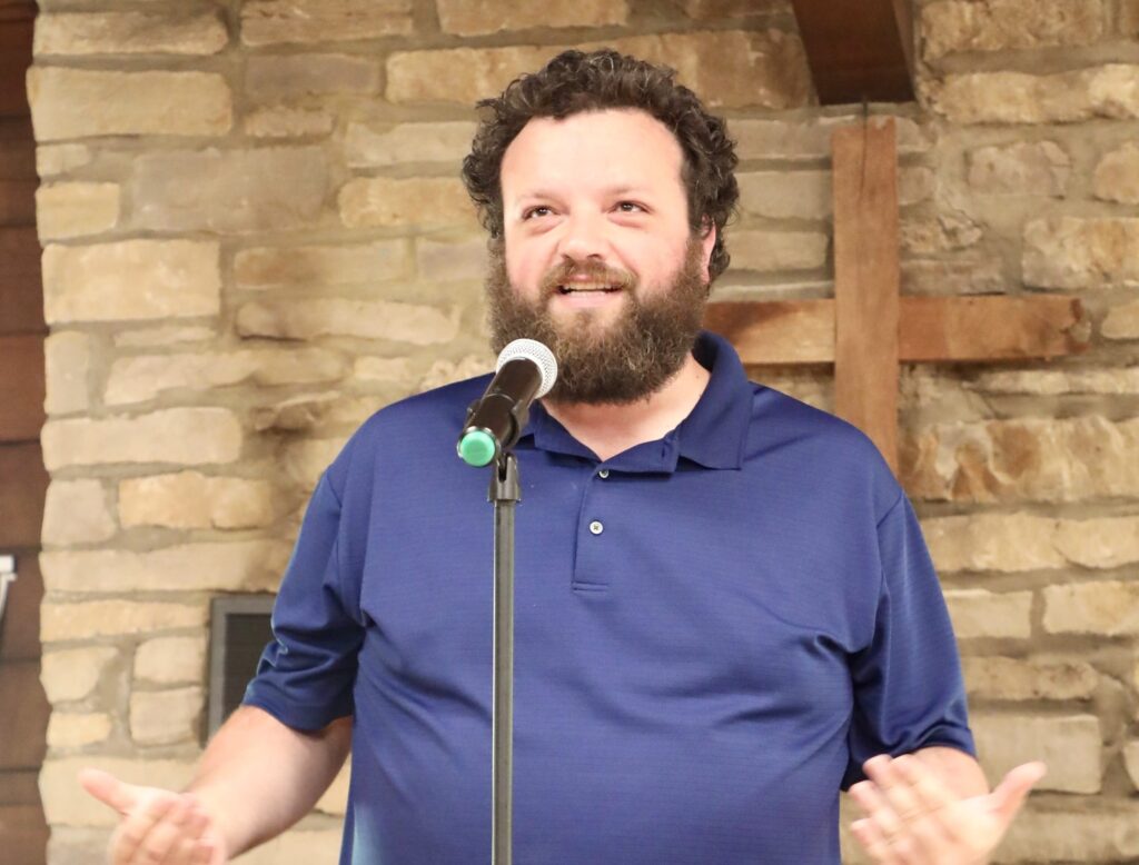 Man speaking at microphone