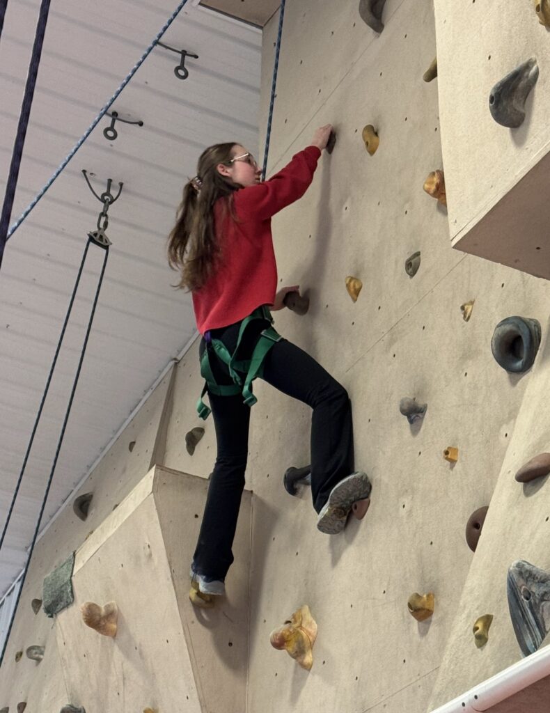 Teen on a climbing wall