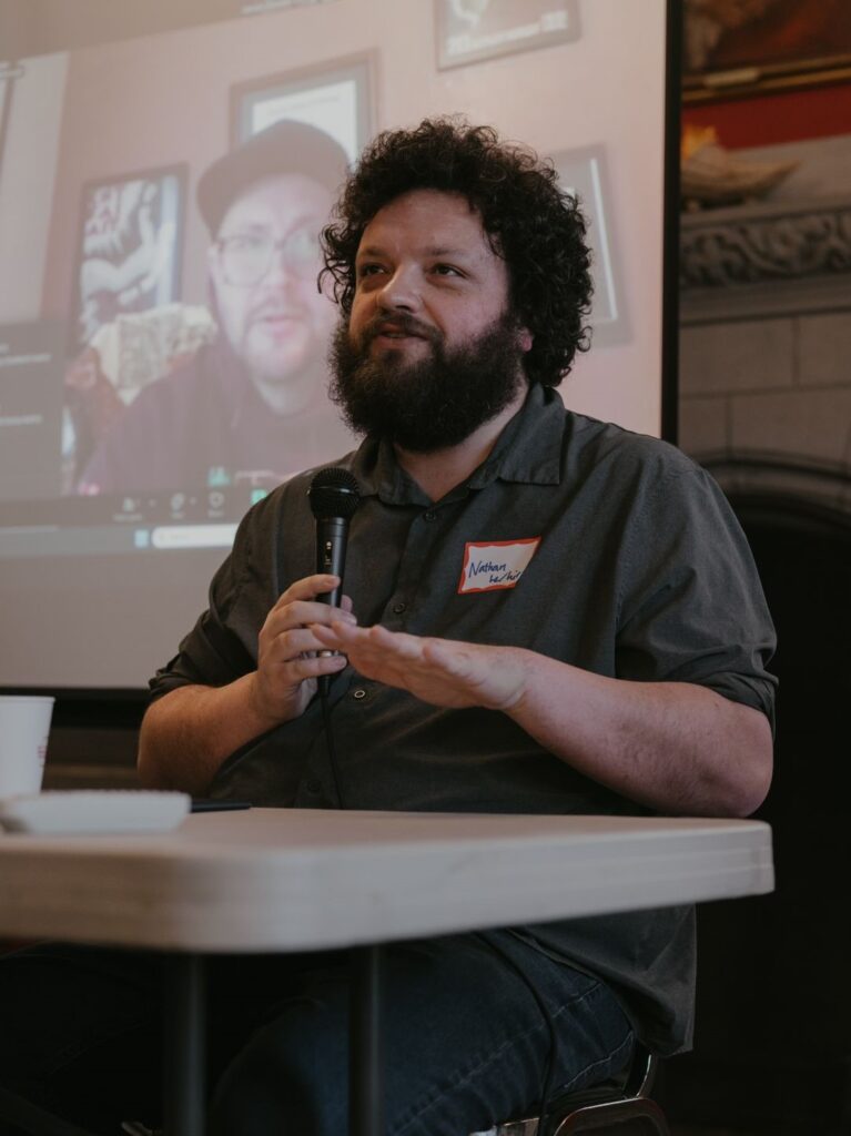 Man talks on a panel