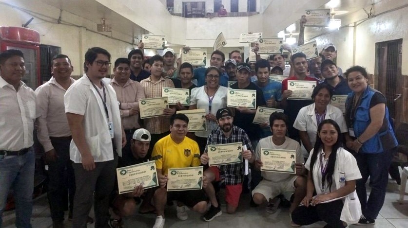 Group of inmates complete seminar on emotional health and violence prevention. 