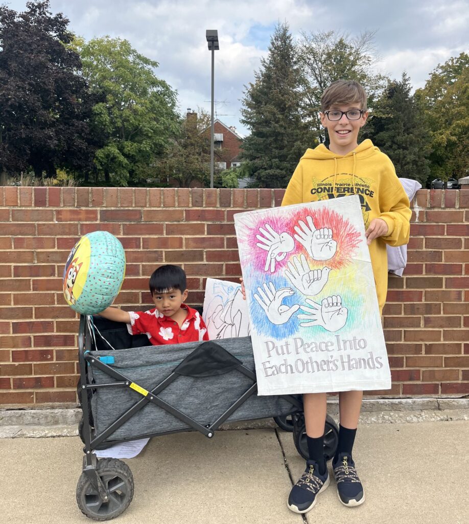 Two boys participate in a protest for peace. 