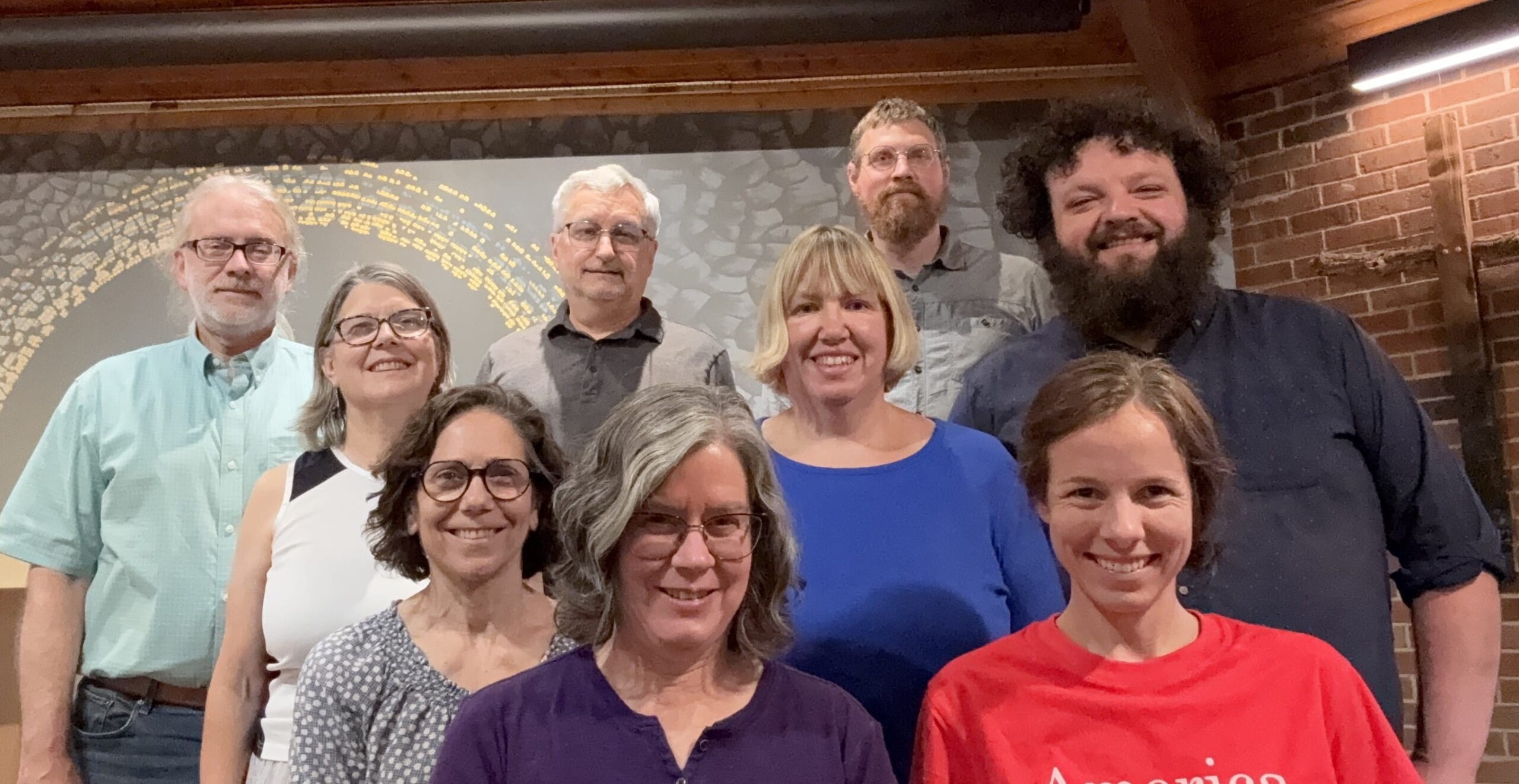 Group of men and women in a church sanctuary.